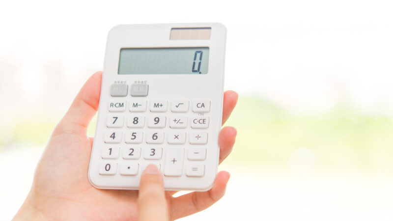Woman's hand with calculator.