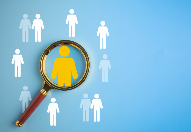 Human Resource Management, Magnifier glass focus on manager icon which is among staff icons for human development recruitment leadership and customer target group concept, HRM