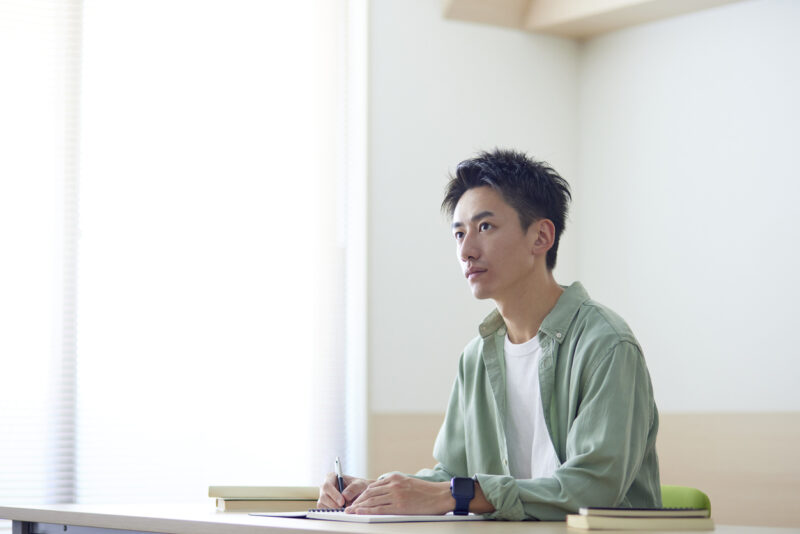 Young Japanese student studying in the classroom