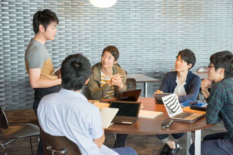 College students are discussing at a lounge of research facilities