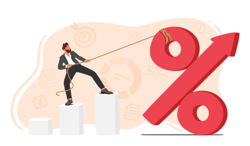 Business Man Character Stands Atop A Column Chart And Pulls Up A Large Percent Sign, Symbolizing An Interest Rate Hike For Financial Or Economic-themed Promotions. Cartoon People Vector Illustration