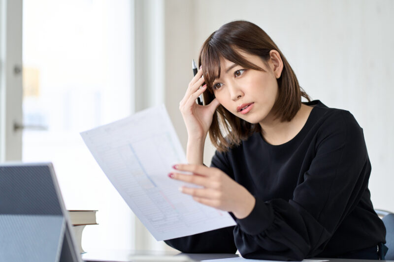 Asian woman worried about tax return