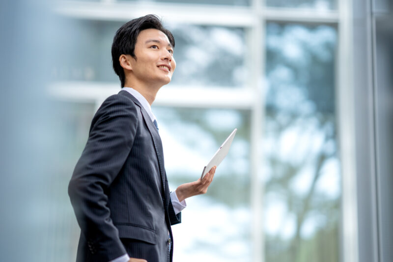 A man in a suit walking in the business district