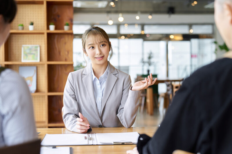 Asian business woman selling to restaurant owners